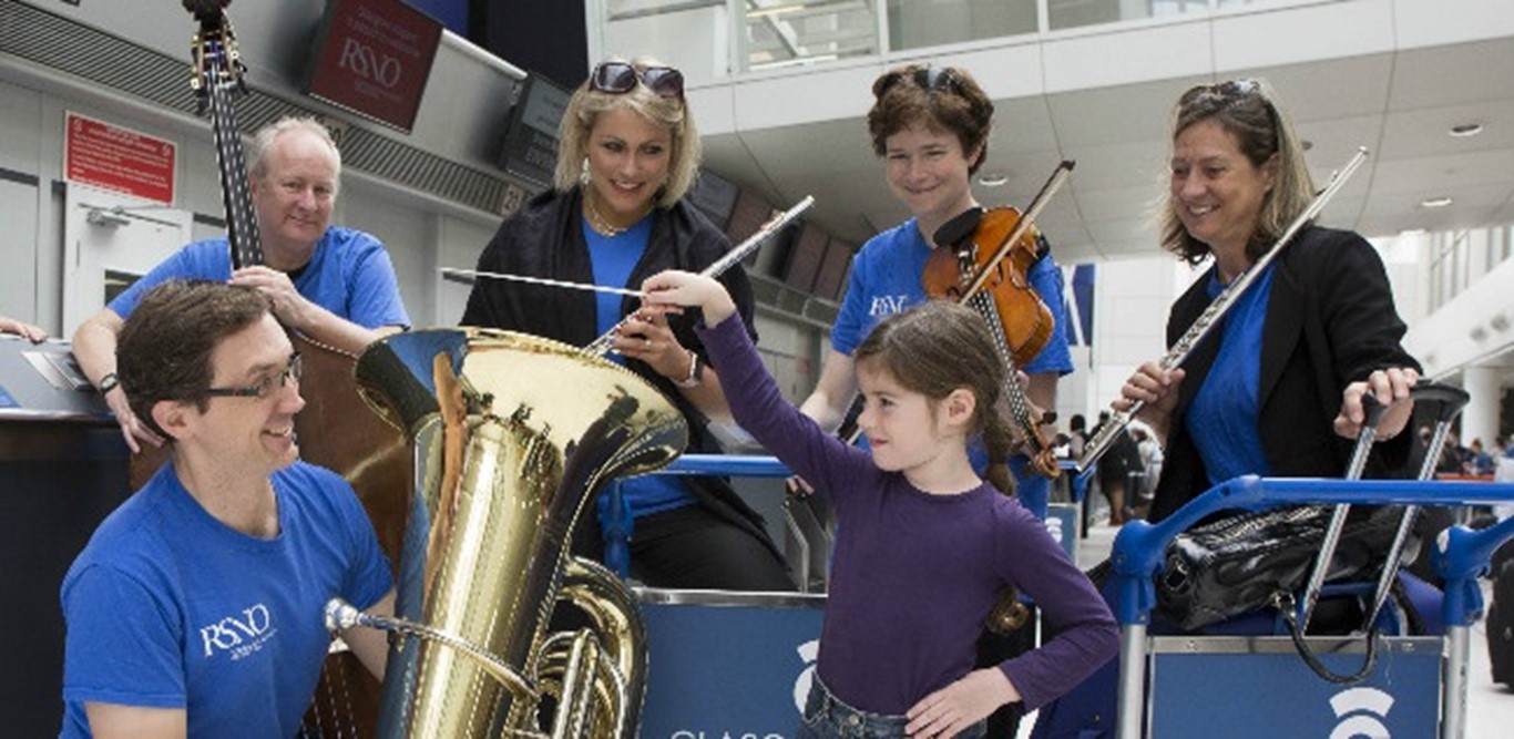 Poll position for podium apprentices - two passengers win orchestra approval for first-time conducting a Glasgow Airport